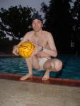 Crouched next to water in a white Speedo (feet)