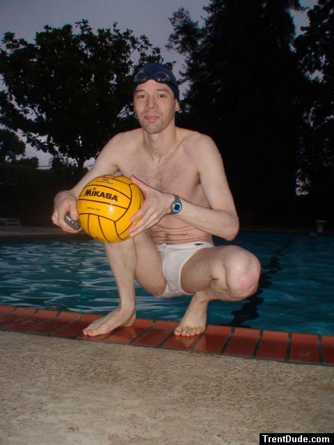 Crouched next to water in a white Speedo (feet)