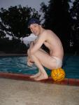 It takes skill to balance his butt on the water polo ball while wearing a white Speedo
