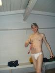 Smiling in a white Speedo