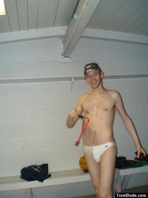 Smiling in a white Speedo