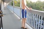 Shirtless in blue nylon Addidas shorts