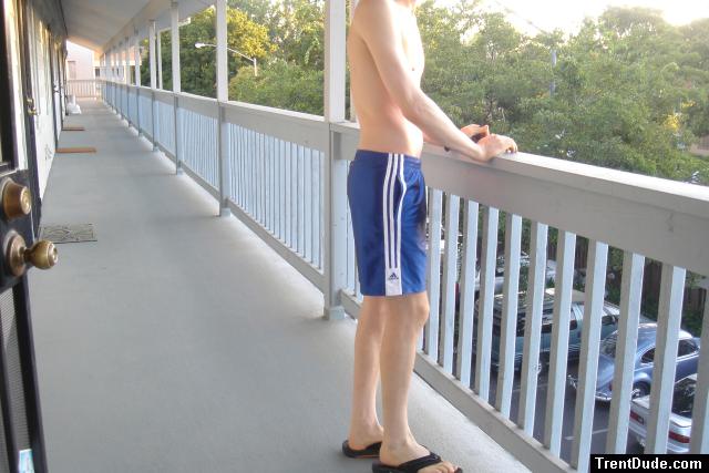 Shirtless in blue nylon Addidas shorts