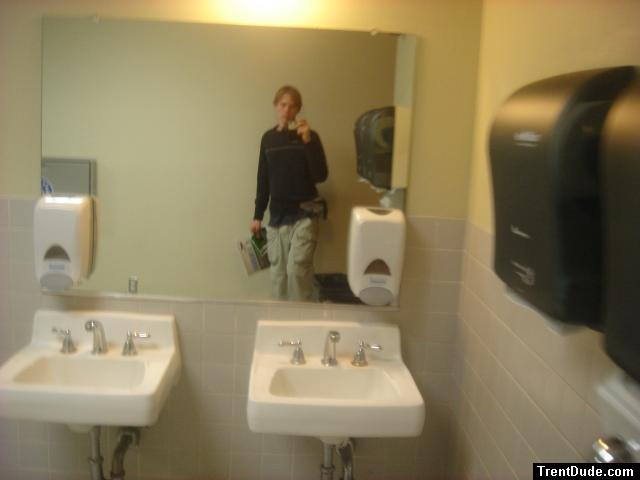 Trent in restroom wearing cargo pants