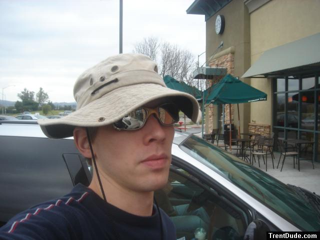Trent at starbucks wearing sunglasses (he's not there for the coffee :)