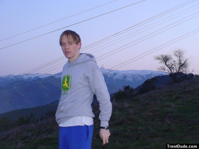 John deere sweatshirt, blue sweat pants, snowy mountain