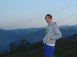 Getting up early to check the cows in blue sweats pants and snowy mountain