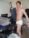 Preparding to launder his T-shirt