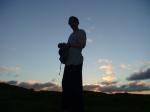 Outside at sunrise in a t-shirt