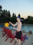 Tossing a water polo ball, wearing Tyr Fusion 2 swim jammer