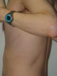 Closeup chest hair and Swimovate pool-mate lap counting watch