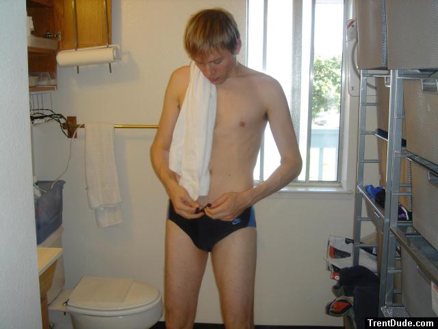 Golden hair swimmer trying to tie the Nike swim suit