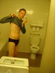 Black speedos, changing in a bathroom