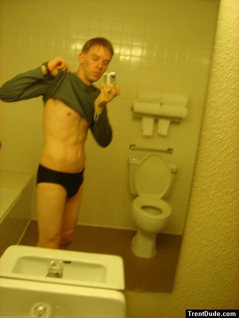 Black speedos, changing in a bathroom