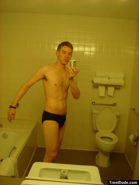 Black speedos, changing in a bathroom