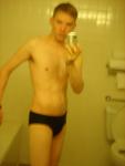 Black speedos, changing in a bathroom