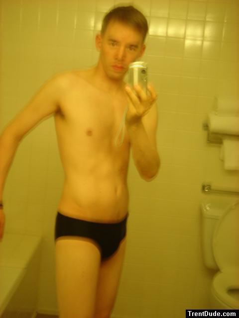 Black speedos, changing in a bathroom