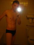 Black speedos, changing in a bathroom