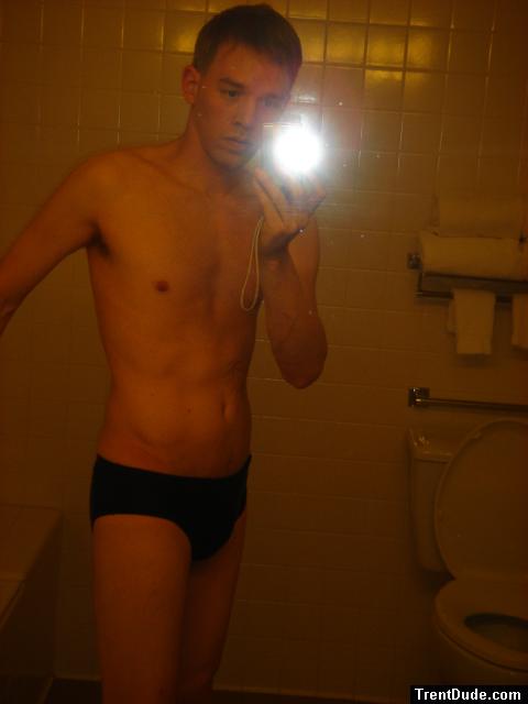 Black speedos, changing in a bathroom