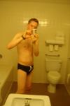 Black speedos, changing in a bathroom