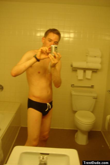 Black speedos, changing in a bathroom