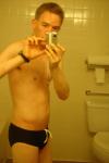 Black speedos, changing in a bathroom
