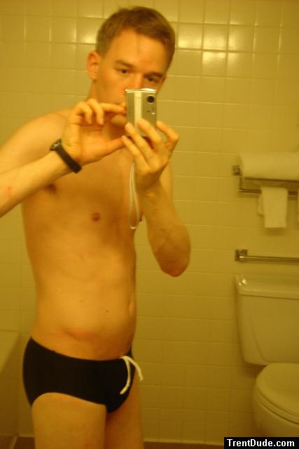 Black speedos, changing in a bathroom