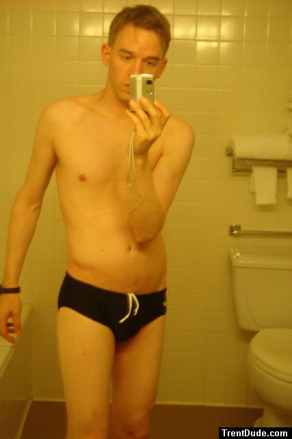 Black speedos, changing in a bathroom