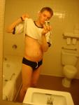 Black speedos, changing in a bathroom