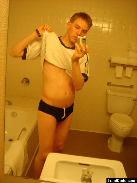 Black speedos, changing in a bathroom