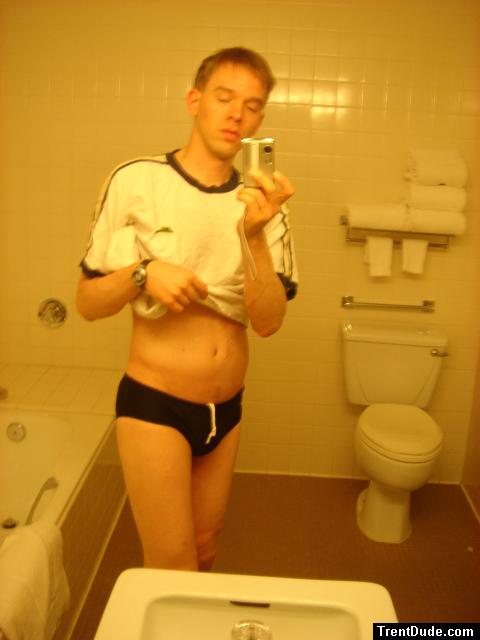 Black speedos, changing in a bathroom