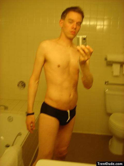 Black speedos, changing in a bathroom