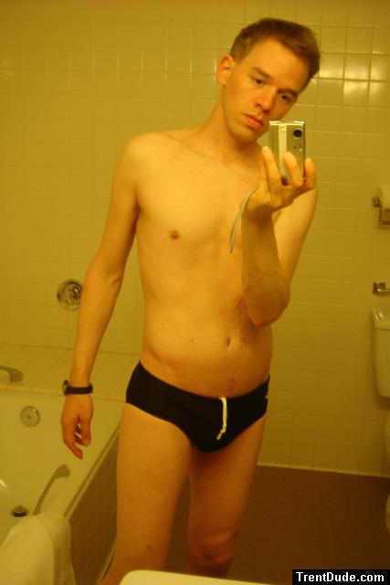 Black speedos, changing in a bathroom