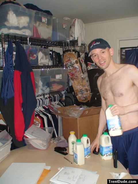 Holding raw milk in blue shorts