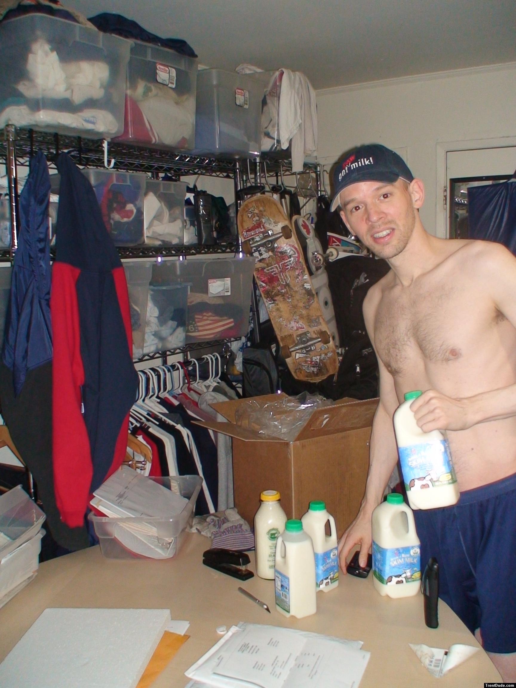 Holding raw milk in blue shorts