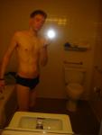 Black speedos, changing in a bathroom
