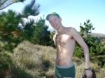 Standing in green hanes underwear near the ocean, hairy chest