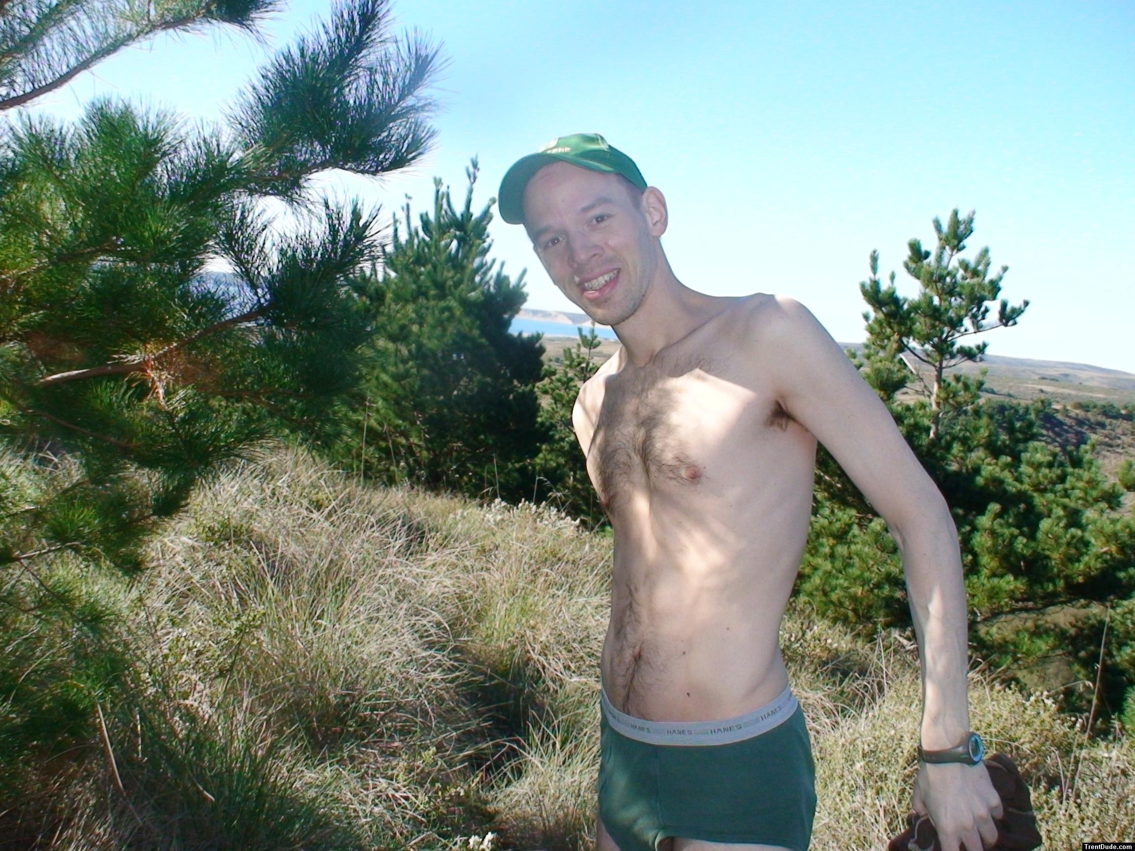 Standing in green hanes underwear near the ocean, hairy chest