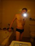Black speedos, changing in a bathroom