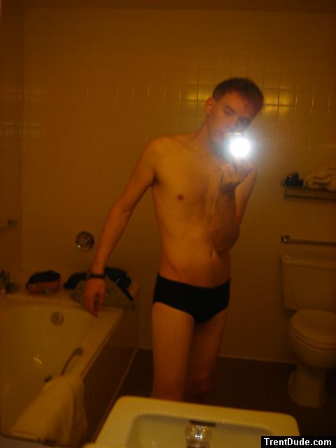 Black speedos, changing in a bathroom