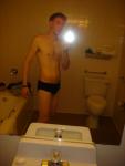 Black speedos, changing in a bathroom