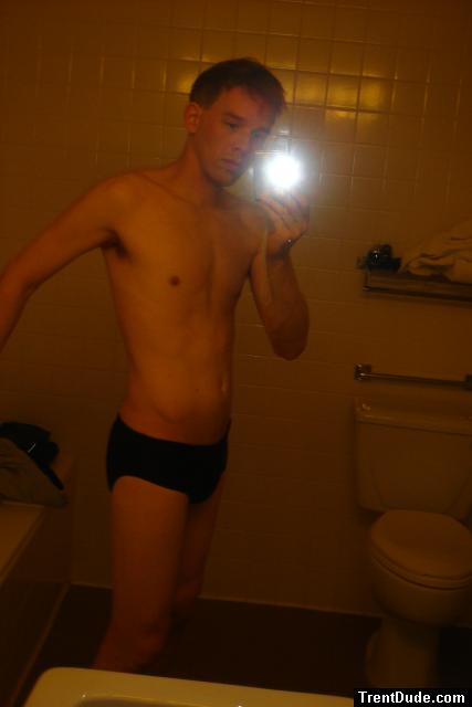 Black speedos, changing in a bathroom