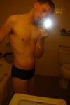 Black speedos, changing in a bathroom