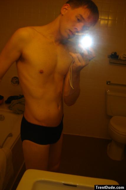 Black speedos, changing in a bathroom