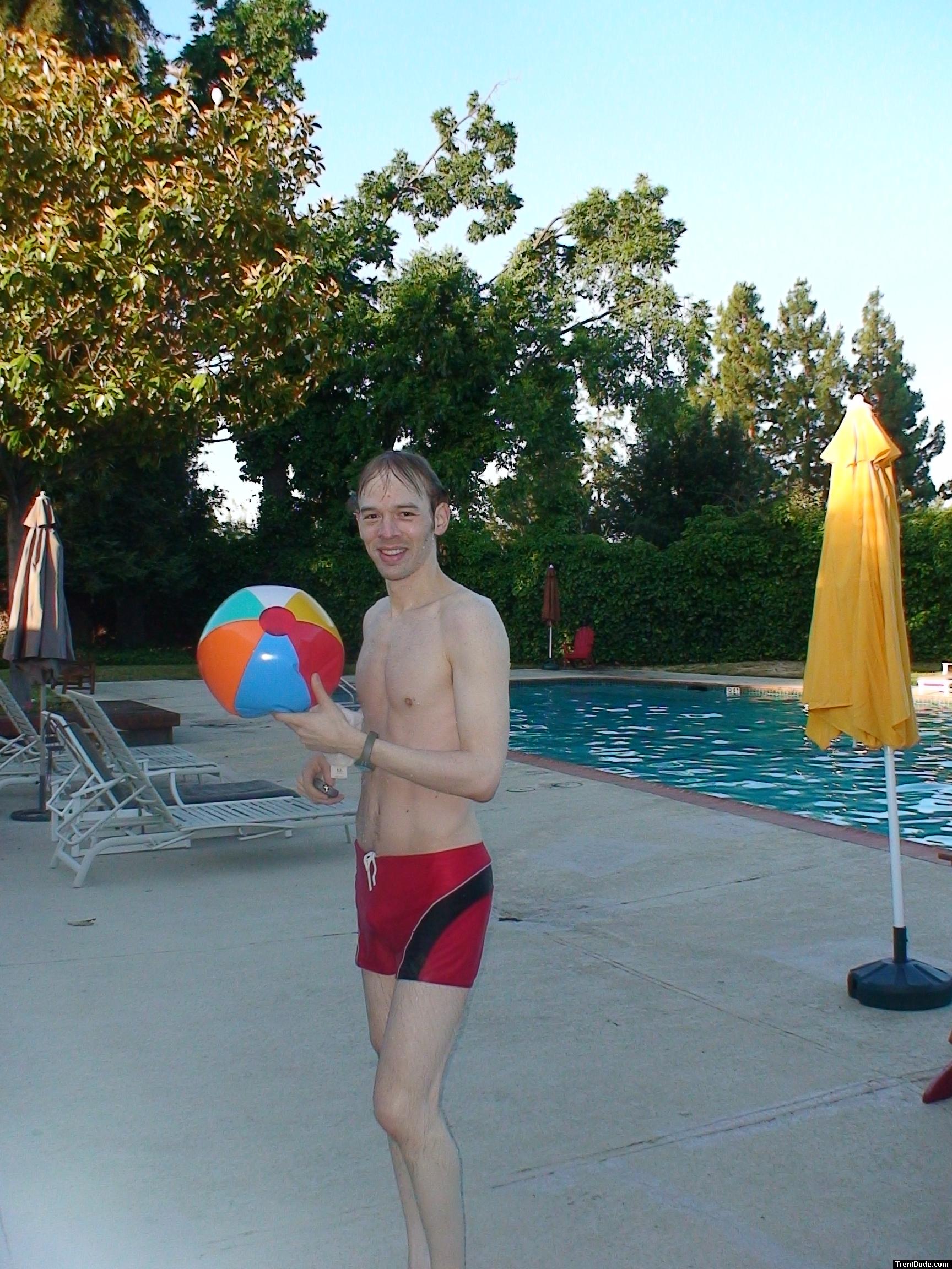 Red speedo jammer, and beach ball