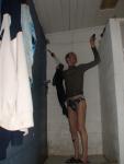 Pulling off wetsuit in the shower