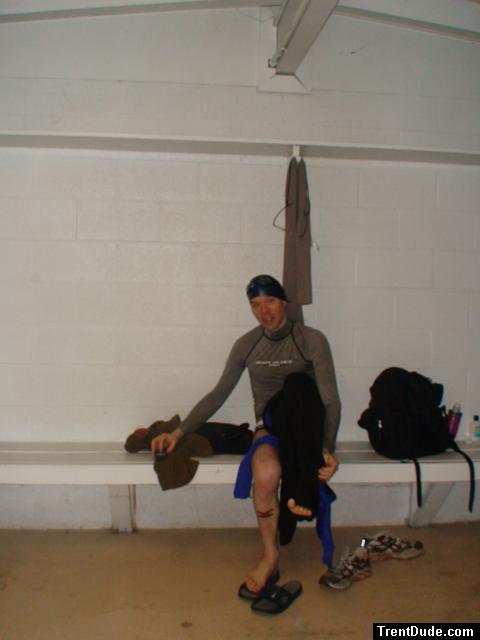 Puttig on a tight wetsuit with a speedo underneath