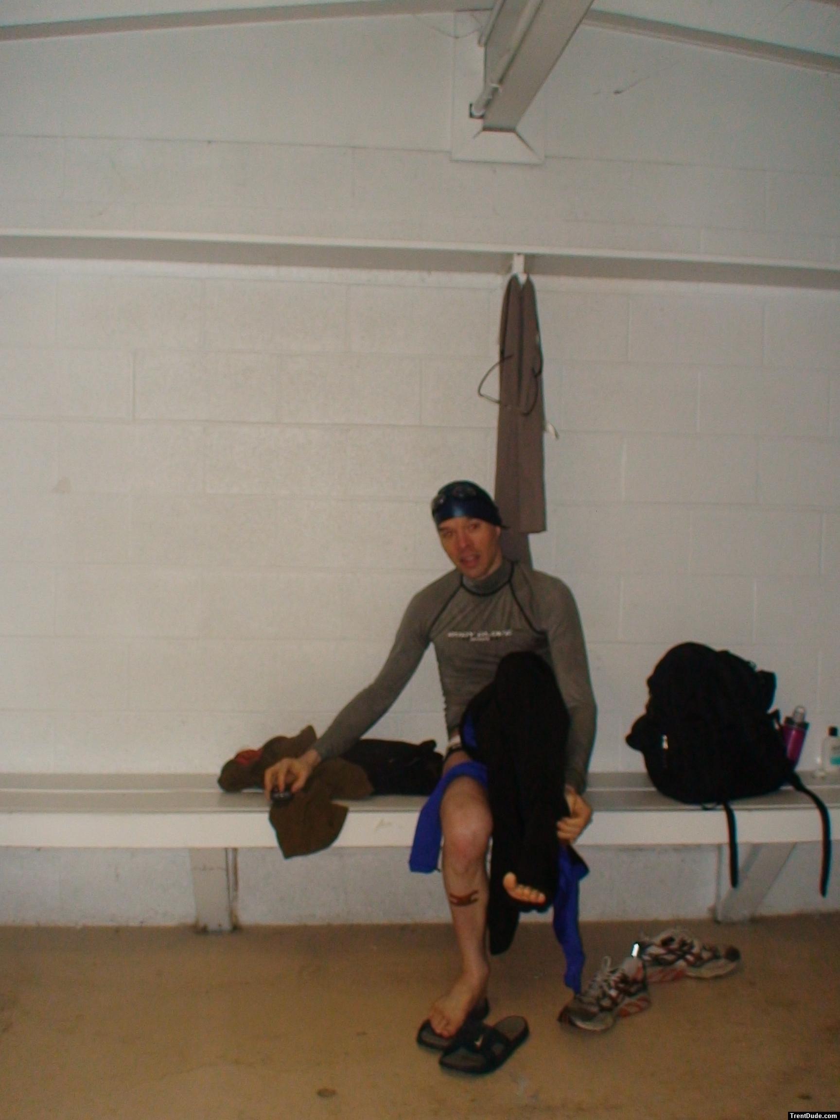 Puttig on a tight wetsuit with a speedo underneath