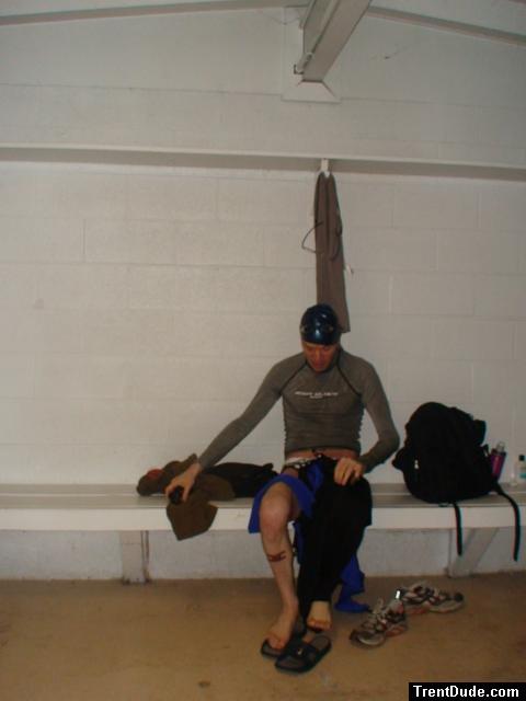 Puttig on a tight wetsuit with a speedo underneath