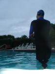 swimmer dude in wetsuit on cloudy day